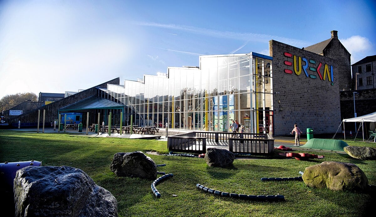 Exterior of Eureka! The National Children's Museum with a grassy area.