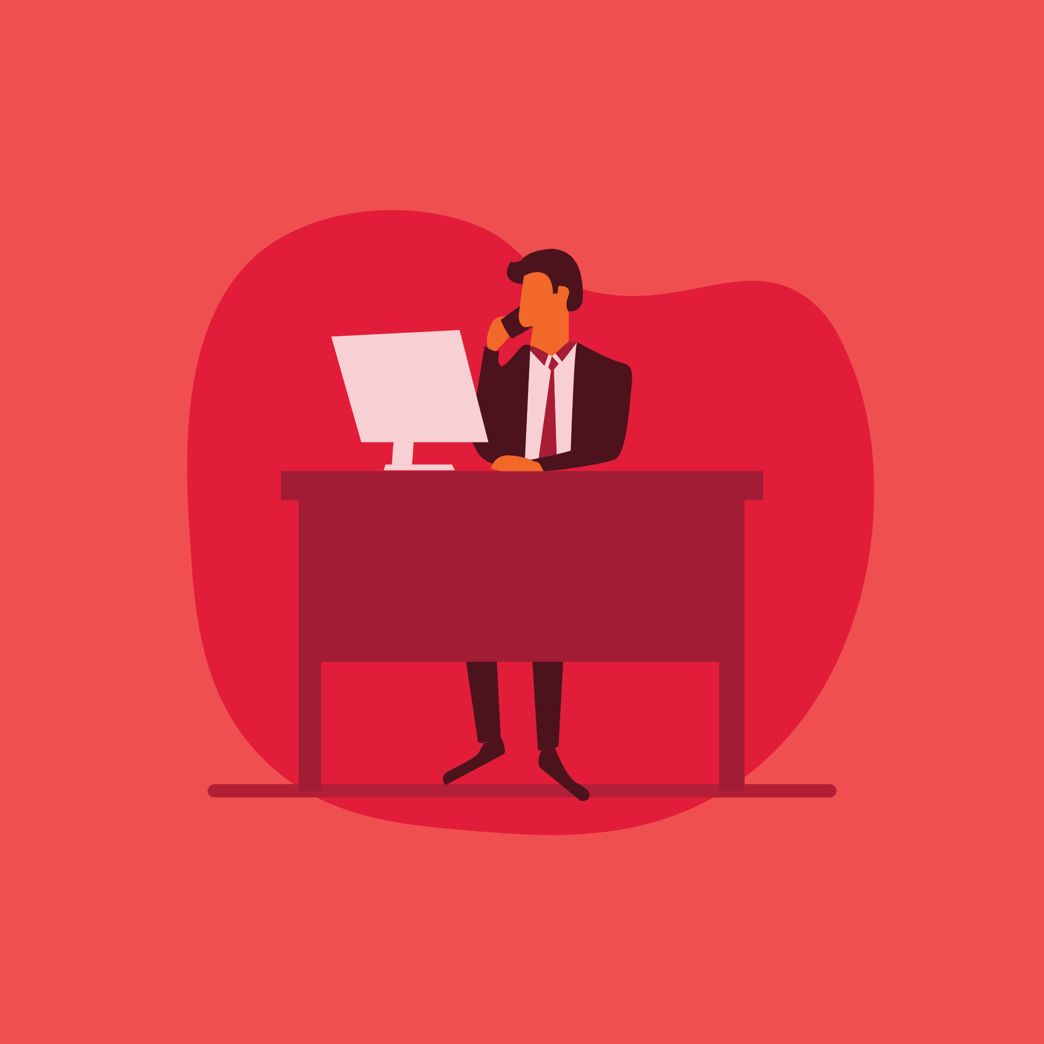 A businessman sitting at a desk with a computer while talking on the phone.